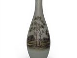 a vase that has a picture of a tree on it