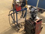 a machine that is sitting on the ground next to other machines