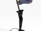une photo d'une lampe de table munie d'un abat-jour en verre