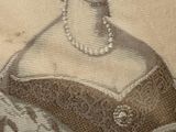 portrait of a woman in a dress with pearls and a tiable