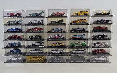 a lot of toy cars that are in a display case