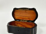 an image of a small wooden box on a white surface