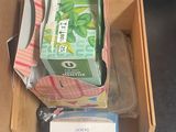 a box of toothpaste and a box of toothpaste on a table