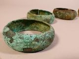 several pieces of green pottery sitting on top of a white surface