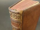 an old book that is sitting on a table