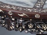 a close up of a table with a clock on it