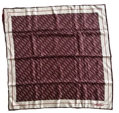 a red and white square scarf with a pattern on it