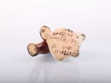 a small teddy bear that has a message on it
