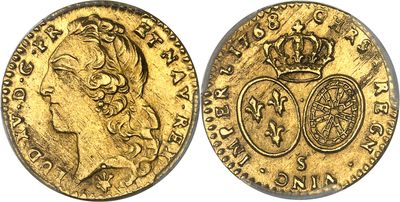 une pièce souveraine en or surmontée d'une couronne