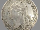 gros plan d'une pièce de monnaie sur laquelle figure un visage de femme