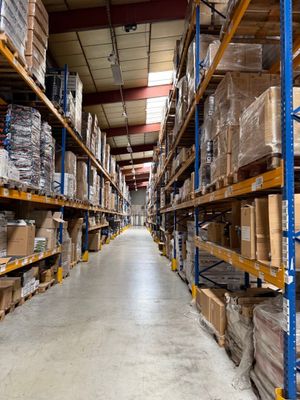 a long aisle of shelves with boxes and boxes on them