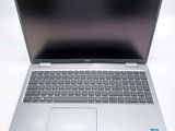 an open laptop computer sitting on top of a white table