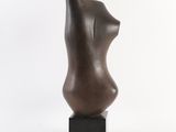 bronze sculpture of a woman ' s torso on a black base