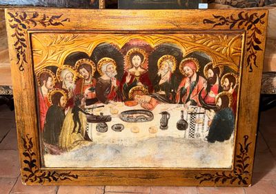 une image d'un tableau représentant un groupe de personnes assises autour d'une table