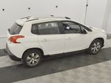 a picture of a white car parked in a garage