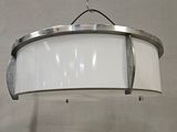 a white light hanging from the ceiling in a room