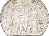 a close up of a silver coin with a group of people on it