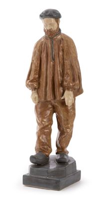 figurine of a man with a hat and jacket standing on a base