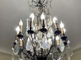 a chandelier hanging from the ceiling in a room