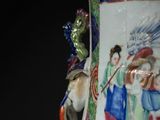 a vase with a painting on the side of it