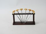 a small wooden stand with a bunch of bananas on it