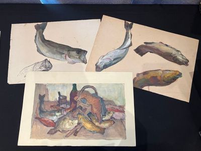 three pictures of fish on a table with a black background