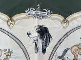 an umbrella with a picture of horses and dogs on it