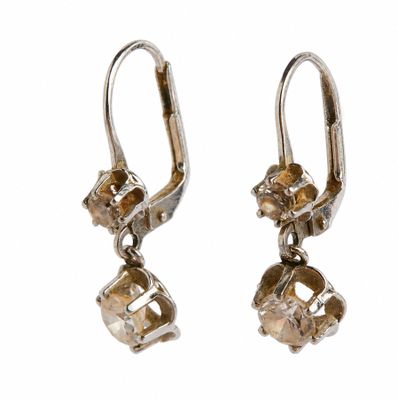 the earrings are made of silver and gold colored crystals