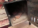 a small oven sitting on top of a wooden table