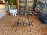 a metal rack that has a bunch of flowers in it