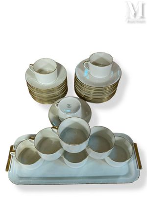 a tray with cups and saucers and a tray with plates on it