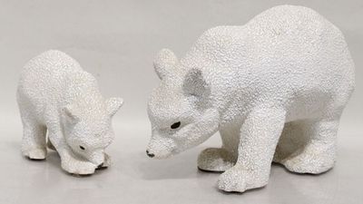 two figurines of a polar bear and a polar bear