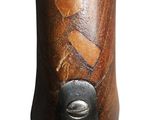 a close up of a wooden object with a piece of wood sticking out of it
