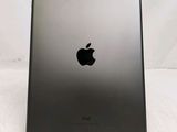 a close up of the back of an ipad with a black apple logo on it