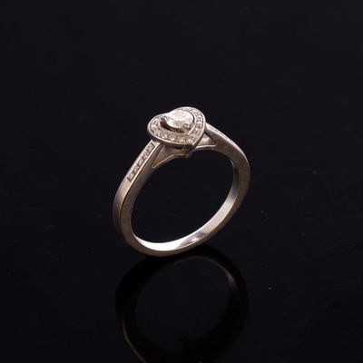 an engagement ring with a pear shaped diamond set in white gold