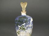 an image of a glass bottle with a heart on it