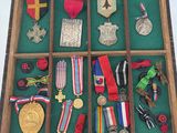 many medals and medals displayed in a display case