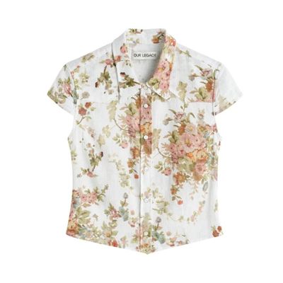 the shirt is white and has a floral print on it