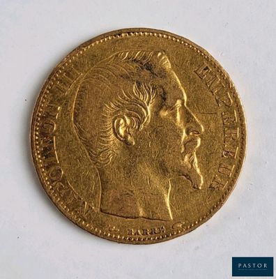 gros plan d'une pièce d'or sur laquelle figure le visage d'un homme