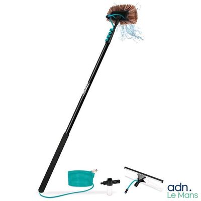 a close up of a broom with a brush and a cord