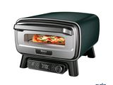 une photo d'un four grille-pain contenant une pizza