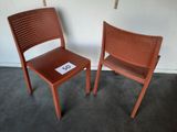 two chairs sitting next to each other on the floor