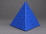 a blue triangular shaped object with holes in the middle