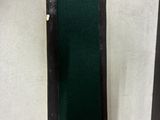 two pieces of wood with a black frame on the wall