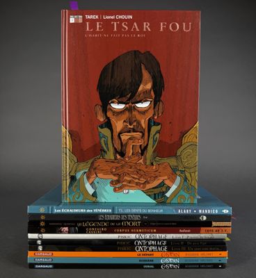books stacked on top of each other in front of a gray background