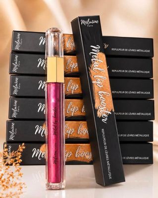 a stack of lipsticks next to a stack of boxes