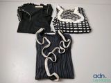 three pieces of clothing that are on a table