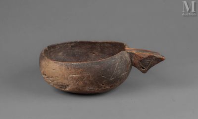 a close up of a bowl on a table with a gray background