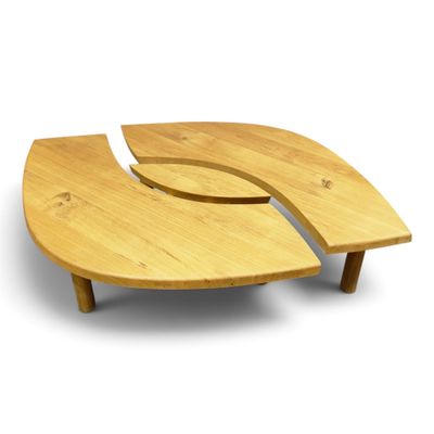 two pieces of wood sit on top of each other on a white surface