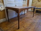 a table that is sitting on a hard wood floor